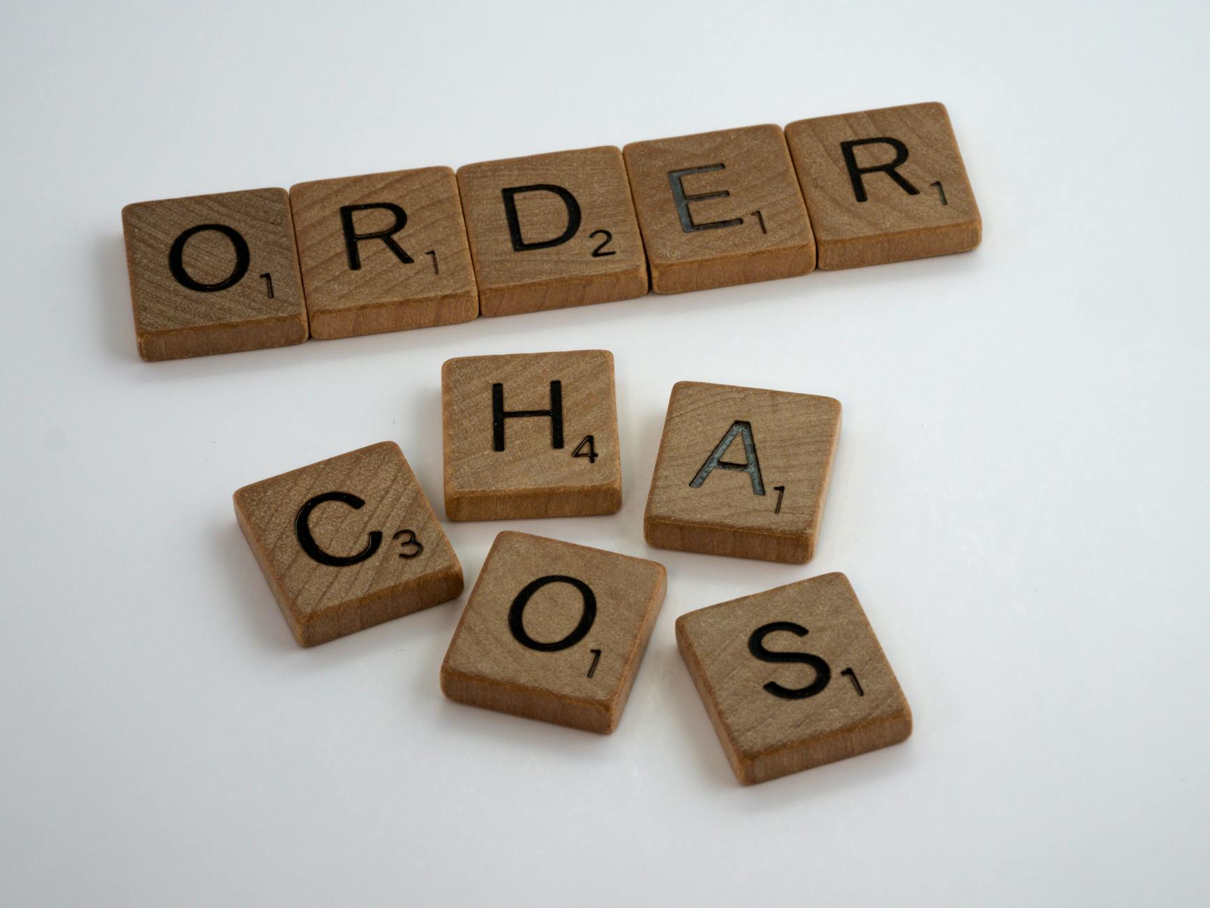 close up shot of scrabble tiles on a white surface